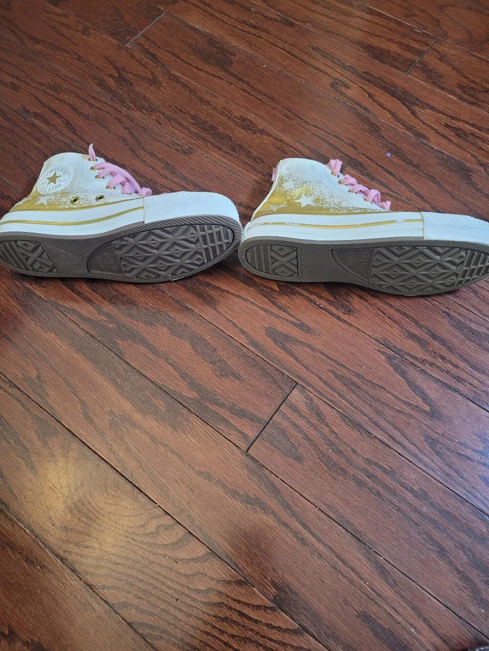 White High-Top Converse Chuck Taylor Sneakers with Pink Laces